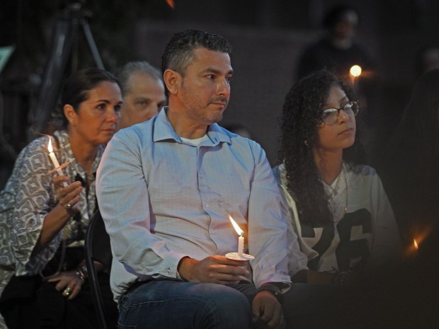 Manuel Albornoz, the uncle of Andrea Rodriguez Avila who was killed in the Rice University shooting, takes part in a candle-light vigil at CCBC-Essex where his niece attended before transferring to Rice University. (Kenneth K. Lam/Staff)
