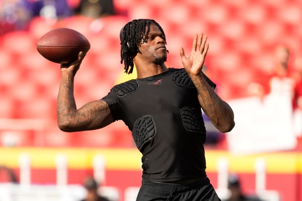 Baltimore Ravens quarterback Lamar Jackson warms up before the start of an NFL football game against the Kansas City Chiefs Thursday, Sept. 5, 2024, in Kansas City, Mo. (AP Photo/Ed Zurga)